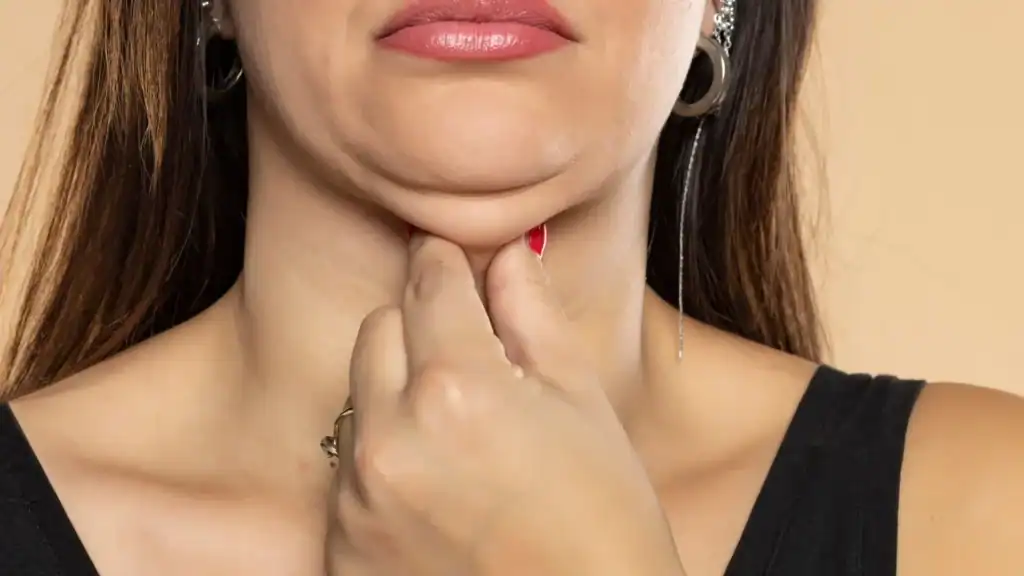 An image of a woman with double chin, sad, worried : Non Surgical Double Chin Removal Treatment in Binley, UK